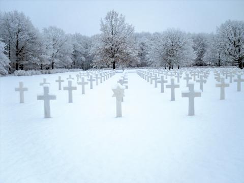 Snow covers the ground at Ardennes American Cemetery in Belgium. More than 5,300 WWII casualties are buried there, and another 462 missing in action are memorialized by name. Photo: ABMC
