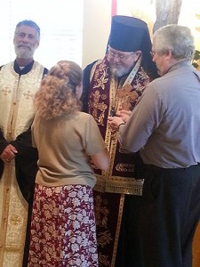 His Grace Bishop David of Sitka and Alaska (center), with OCMC Executive Director Fr. Martin Ritsi (left) and OCMC Missionary Director Dcn. James Nicholas (right), commissions Vasiliki Fotinis for service on an OCMC Mission Team during a recent visit to the Mission Center