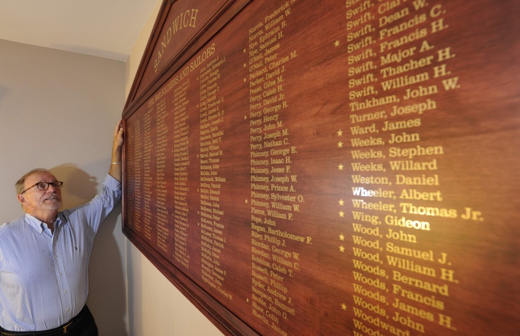 William Daley admires a new plaque bearing the 294 names of Sandwich's Civil War veterans. The plaque is mounted on the wall at Sandwich Town Hall and will be dedicated on Veterans Day. Steve Heaslip/Cape Cod Times